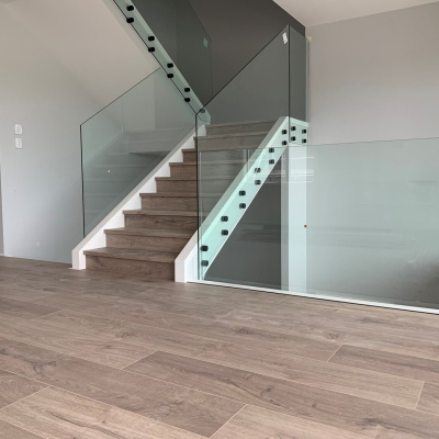 Stair case with laminate stair nosing and laminate flooring